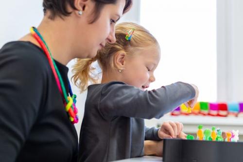 Woman and toddler in an occupational therapy session