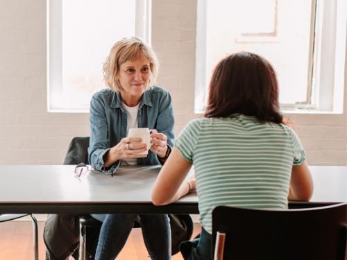 A psychologist talking to her client