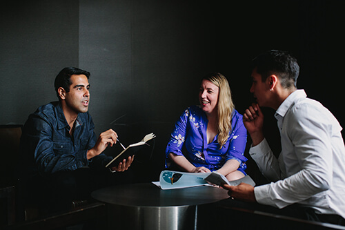 Students discussing the benefits of an online MBA
